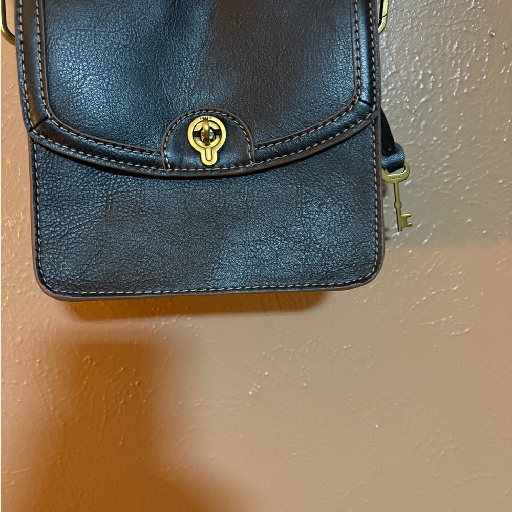 Fossil Black Leather Crossbody Bag with Gold Accents and Fossil attachments